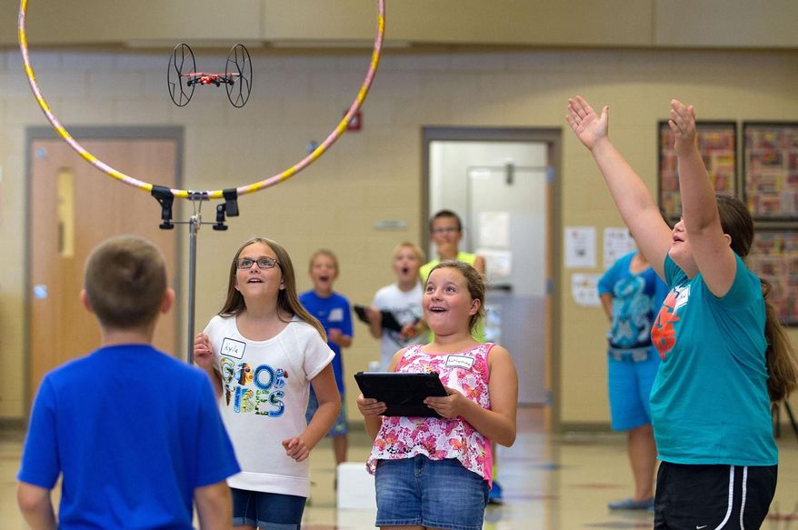 Kids use a drone at Whitetail Elementary in Gretna, Nebraska